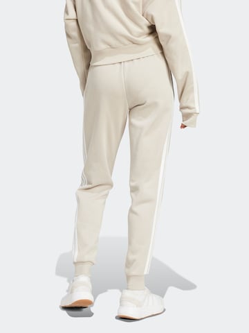 balta ADIDAS SPORTSWEAR Siaurėjantis Sportinės kelnės