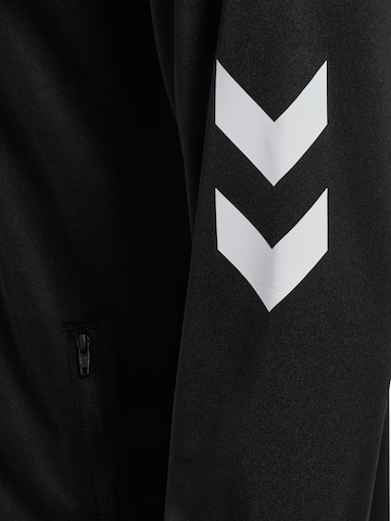 Veste de survêtement 'MOVEMENT' Hummel en noir