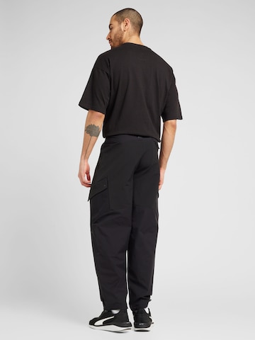 PUMA Normalny krój Spodnie sportowe 'SEASONS' w kolorze czarny