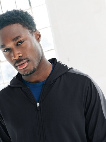 Next Treenitakki värissä musta