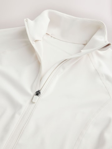 Next - Camiseta funcional en beige