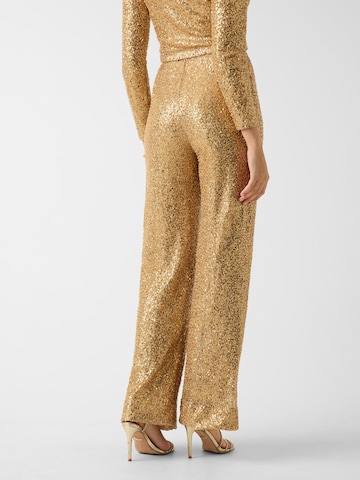 GUESS Flared Pants in Gold