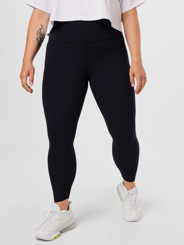 NIKE Skinny Workout Pants in Black: front