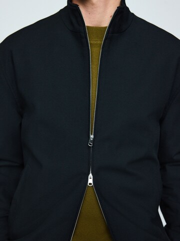 Next Jacke 'Motionflex' in Schwarz