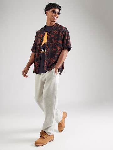 NEW ERA T-shirt 'NE PLAYER' i blå