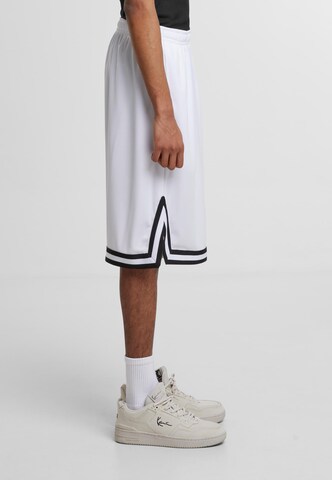 Karl Kani Loose fit Pants 'Signature' in Mixed colors