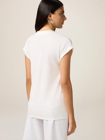 Top di oltre in bianco