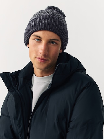 Next Mössa i blå: framsida