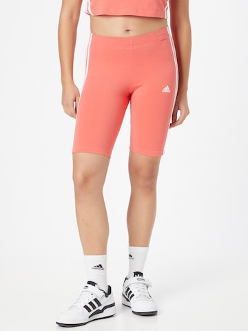 ADIDAS SPORTSWEAR Slim fit Workout Pants in Orange: front
