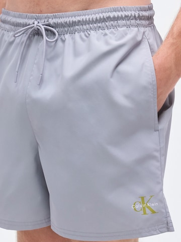 Calvin Klein Swimwear Hlače za k noši | siva barva