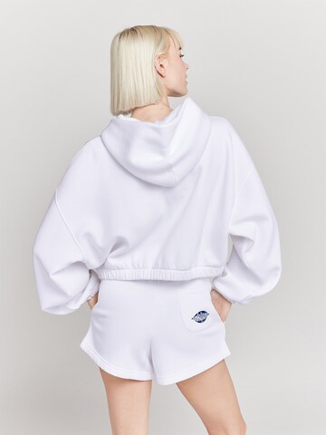 Veste de survêtement 'OG ZIPPER' UNFOLLOWED x ABOUT YOU en blanc : derrière