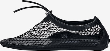 Desigual Slip on -tennarit värissä musta: etupuoli