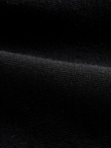 Next - Loosefit Pantalón en negro