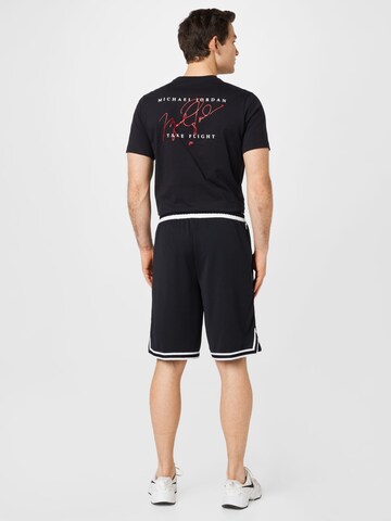 NIKE Loosefit Sportbroek in Zwart