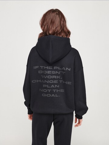 ABOUT YOU x VIAM Studio Hoodie 'Better' in Schwarz: zadná strana