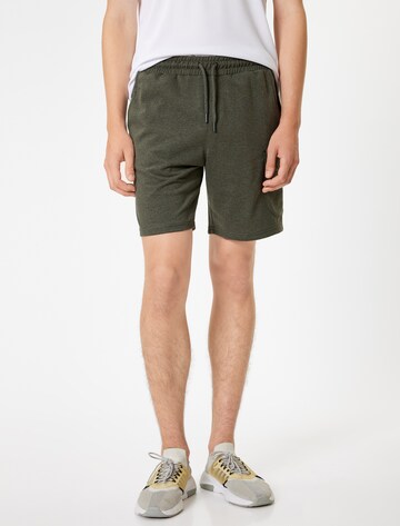 Koton Regular Cargo trousers in Green: front