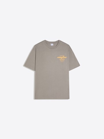 Bershka T-shirt 'PARADISE CLUB' i grå: framsida