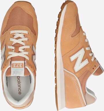 Sneaker bassa '373' di new balance in marrone