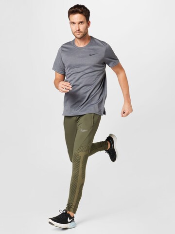 NIKE Regular Workout Pants 'Strike' in Green