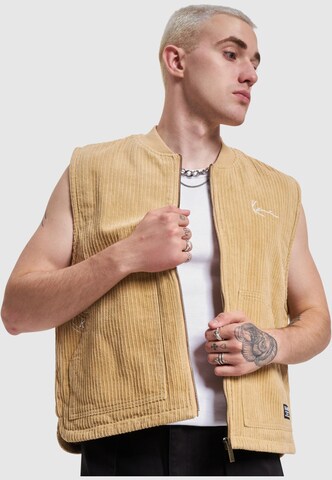 Gilet Karl Kani en beige : devant