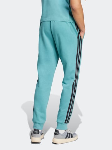 ADIDAS SPORTSWEAR Tapered Sports trousers in Blue