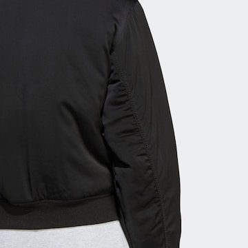 ADIDAS ORIGINALS Between-season jacket 'Premium Essentials' in Black