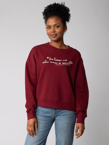 Sweat-shirt 'Das haben wir schon immer so gemacht ' Watapparel en rouge : devant