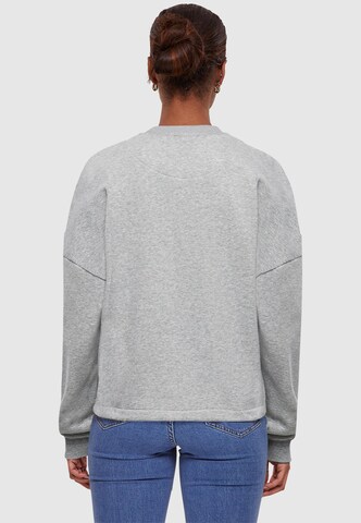 Merchcode Sweatshirt 'Think Different' in Grau