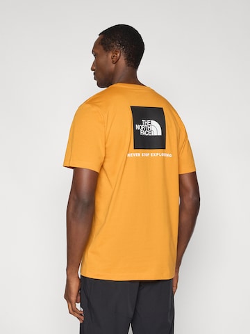 THE NORTH FACE Μπλουζάκι 'EVOLUTION BOX NSE' σε πορτοκαλί: μπροστά