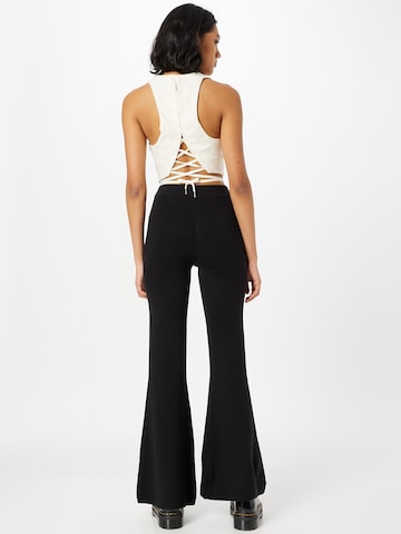 WEEKDAY Flared Trousers in Black