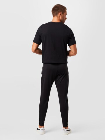 NIKE Slim fit Sports trousers 'Strike' in Black