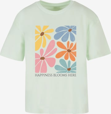 Merchcode T-Shirt 'Happiness Blooms Here' in Grün: Vorderseite
