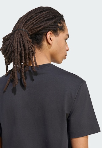 ADIDAS SPORTSWEAR - Camiseta funcional en negro