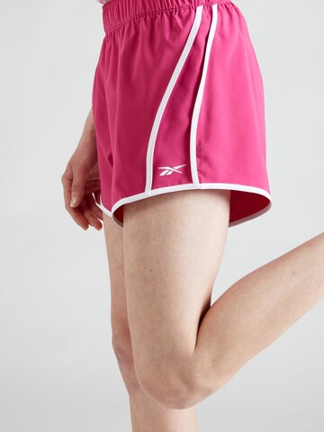 Reebok Normalny krój Spodnie sportowe w kolorze różowy
