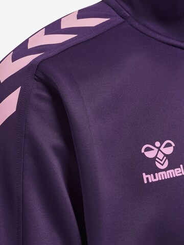 Hummel Urheilullinen collegepaita värissä lila