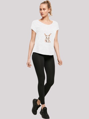 T-shirt 'Niedlicher Osterhase mit Ei' F4NT4STIC en blanc