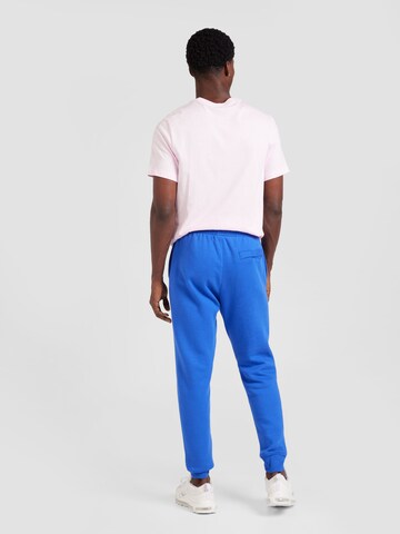 Tapered Pantaloni 'Club Fleece' de la Nike Sportswear pe albastru