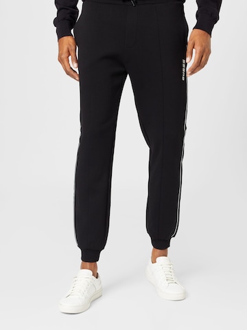 Tapered Pantaloni sport 'MICKEY' de la GUESS pe negru: față