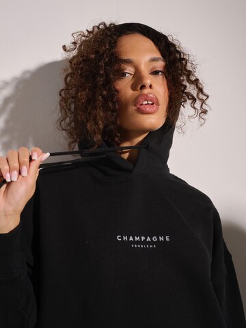 I want the moon Sweater 'Champagne Problems' in Black