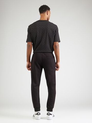 ARMANI EXCHANGE Tapered Housut värissä musta