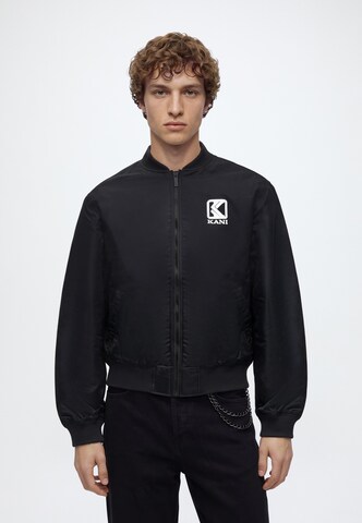 Karl Kani Between-season jacket in Black: front