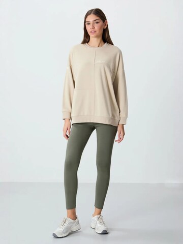 Sweat-shirt Tommy Life en beige