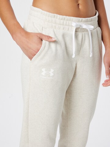 Tapered Pantaloni sportivi 'Rival' di UNDER ARMOUR in beige