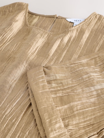 Next - Blusa en oro