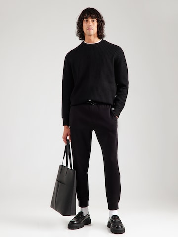 ARMANI EXCHANGE Tapered Housut värissä musta