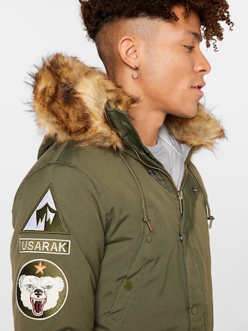 ALPHA INDUSTRIES Winter Jacket 'Arctic Discoverer' in Green