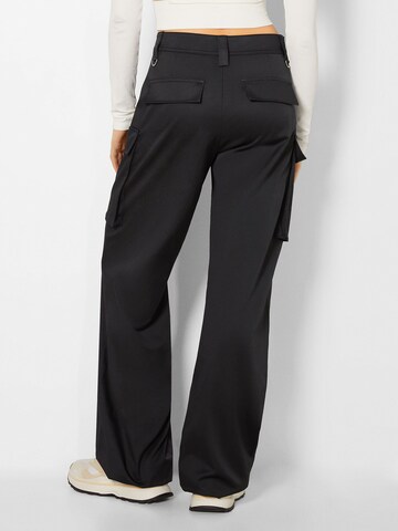 Bershka Regular Cargo trousers in Black