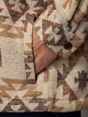 Next Tussenjas in Beige