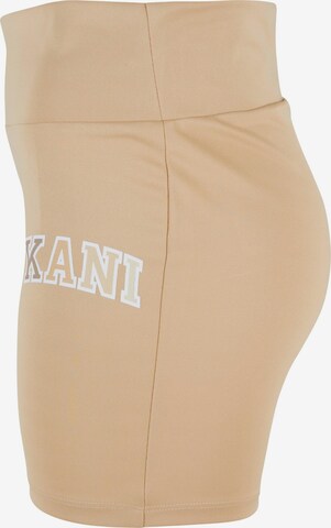 Skinny Pantaloni sportivi di Karl Kani in beige