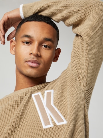 Sweat-shirt Kosta Williams x About You en beige